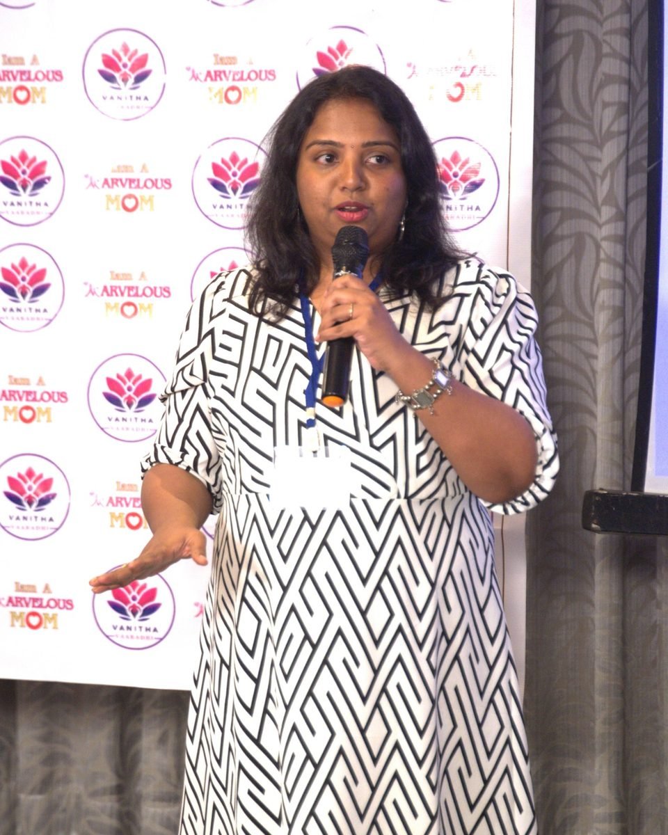Rama Rajesh speaking on financial wellness at a workshop for women